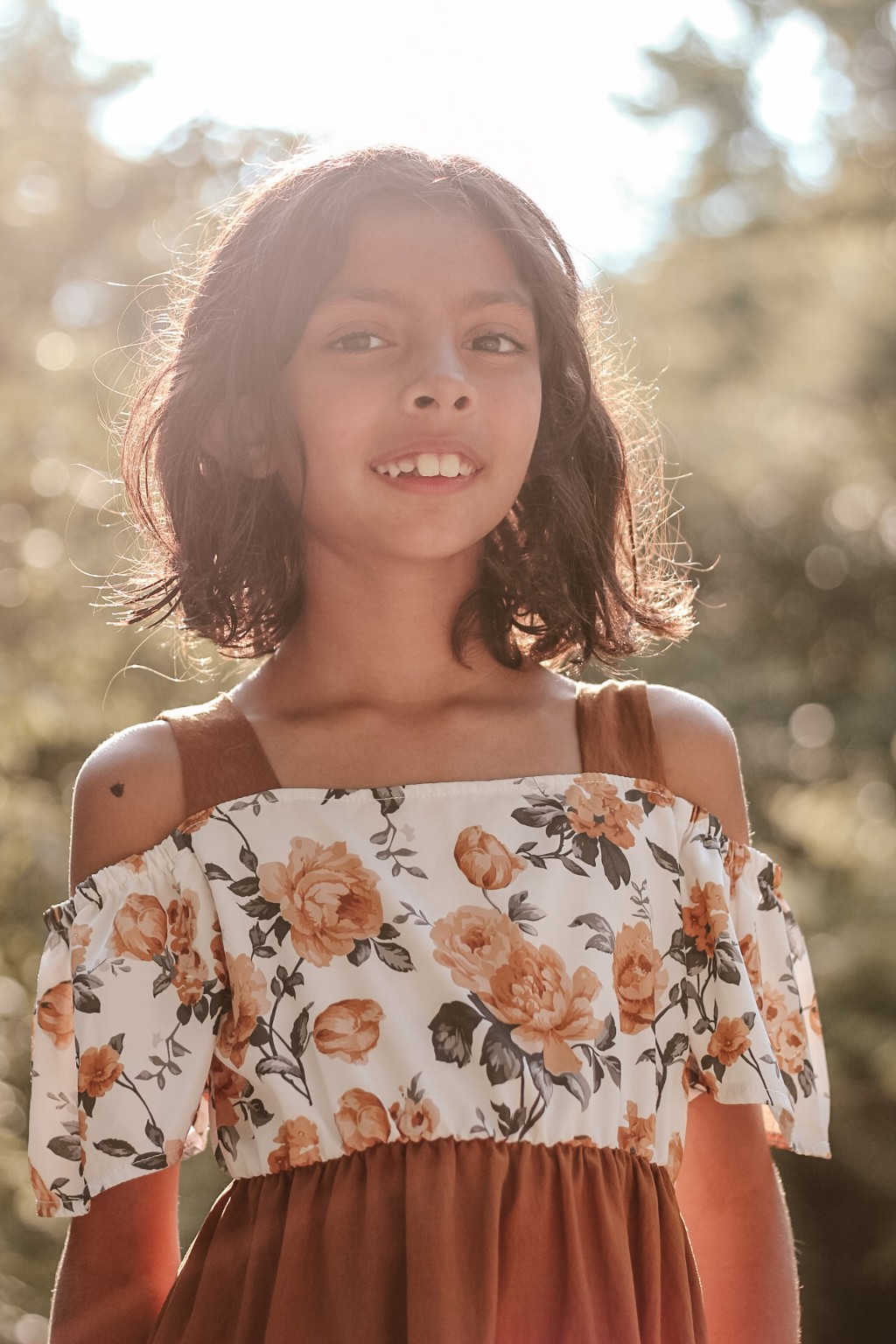 Backlit portrait in a floral dress
